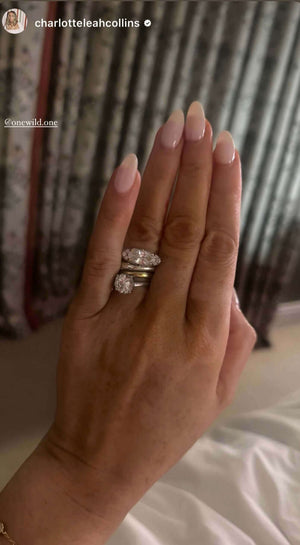 The Rest Of The World Can Wait East-West Silver Ring displayed on a hand with stylish nails.