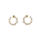 Best Case Scenario Earrings featuring a graduated line of cubic zirconia stones in a modern hoop design.