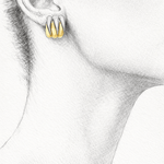 Wild Thing Two-Tone Zig-Zag Earrings showcased on a model, featuring a modern gold and silver design.