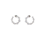 Best Case Scenario Earrings featuring a graduated line of brilliant-cut cubic zirconia stones in an open hoop design.