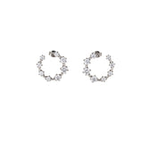 Best Case Scenario Earrings featuring a graduated line of brilliant-cut cubic zirconia stones in an open hoop design.