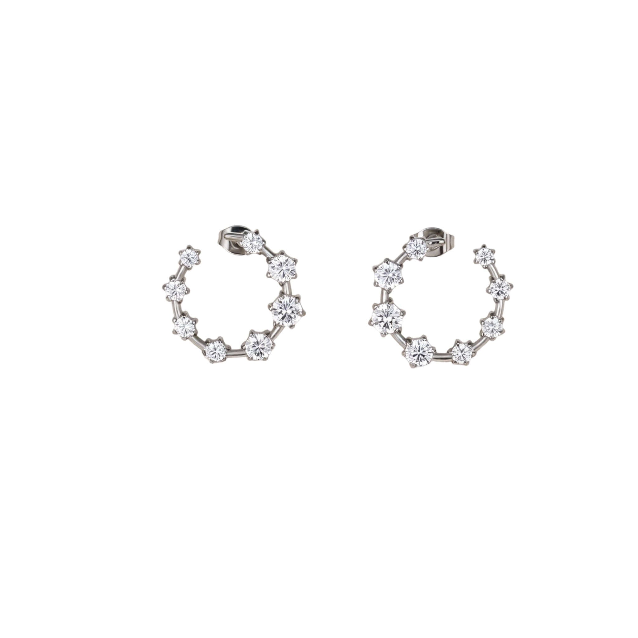 Best Case Scenario Earrings featuring a graduated line of brilliant-cut cubic zirconia stones in an open hoop design.