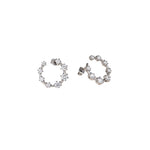Best Case Scenario Earrings featuring graduated cubic zirconia stones in an open hoop design.