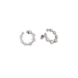 Best Case Scenario Earrings featuring graduated cubic zirconia stones in an open hoop design.