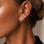 Woman wearing Don’t Overthink It Gold Earrings with sparkling pavé-set stones and textured gold detailing.