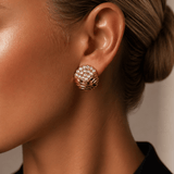Woman wearing Don’t Overthink It Gold Earrings with sparkling pavé-set stones and textured gold detailing.