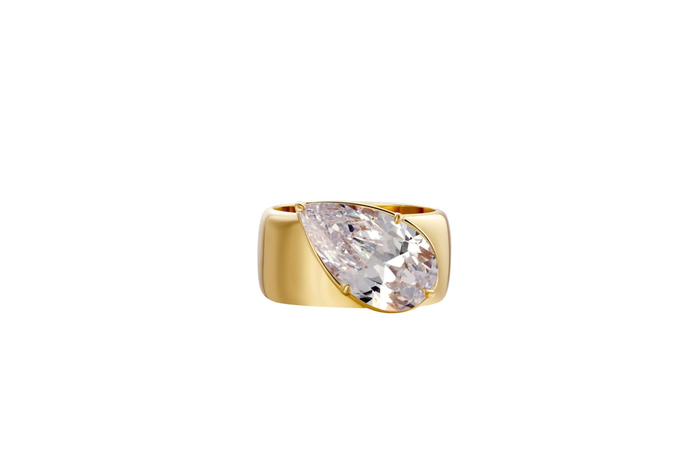 A Wonderful Thing Tilted Pear Cigar Band Ring with a stunning cubic zirconia and luxurious 14K PVD gold plating.