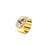 A Wonderful Thing Tilted Pear Cigar Band Ring featuring a large cubic zirconia set in a gold-plated brass band.