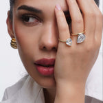 Close-up of a model showcasing the You Got This Pear Cut Halo Ring, featuring elegant pear cut design and gold accents.