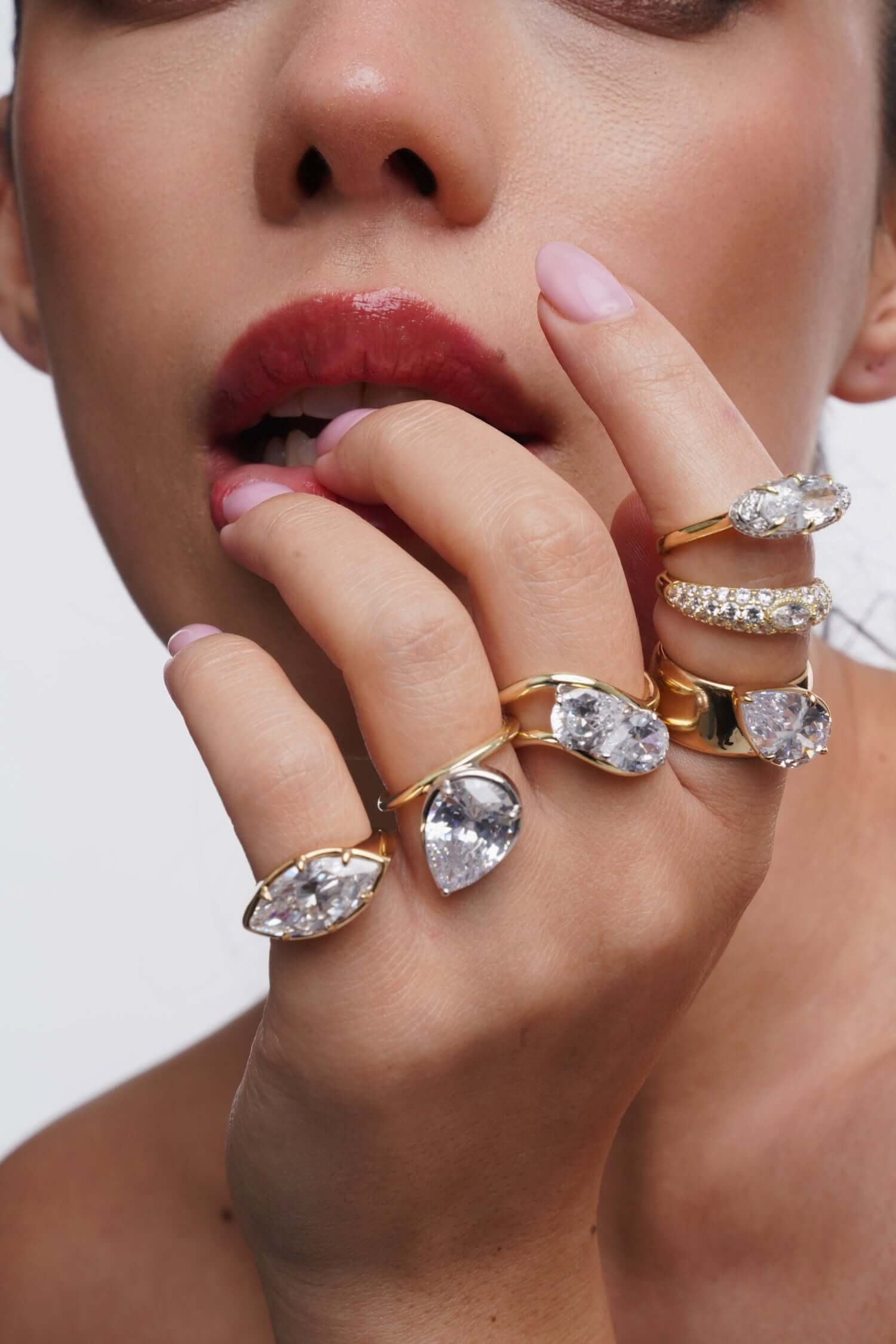 Your Level Of Audacity Ring worn by a model showcasing multiple rings with sparkling cubic zirconia stones.