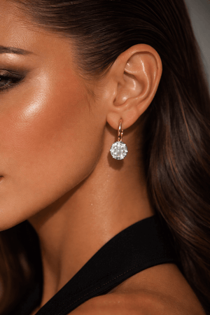 Model wearing I’m Not Like The Rest Two-Tone Earrings showcasing cubic zirconia stones in elegant design.