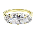 The Rest Of The World Can Wait East-West Gold Ring featuring a bold design with a central stone and detailed basket accents.