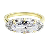 The Rest Of The World Can Wait East-West Gold Ring featuring a bold design with a central stone and detailed basket accents.