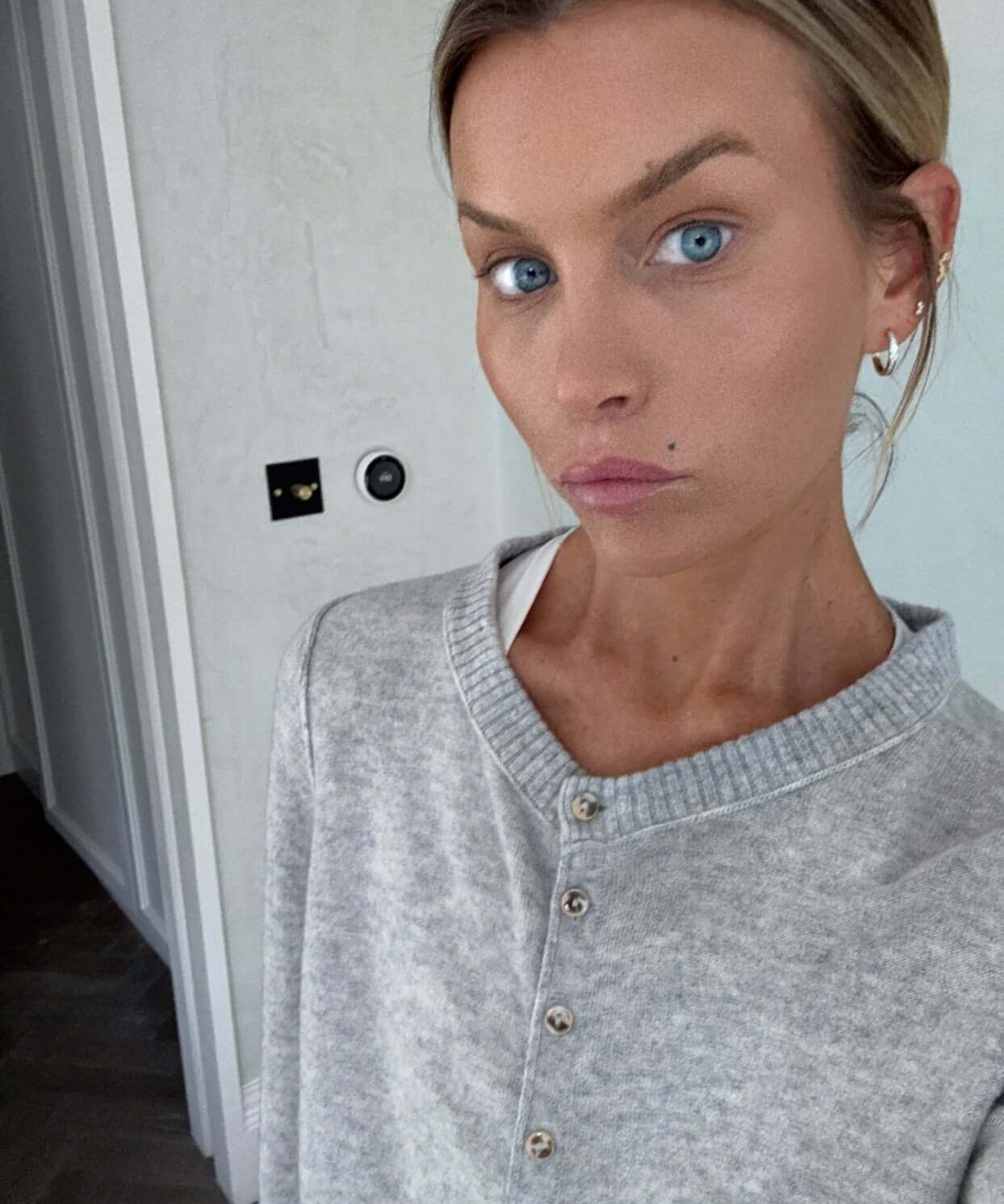 You Are Perfect Gold Hoop Earrings worn by a model with a grey sweater and natural makeup, showcasing elegance and style.