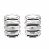 The Best Silver Hoop Earrings in a sculptural design, crafted with durable brass and luxurious rhodium plating.