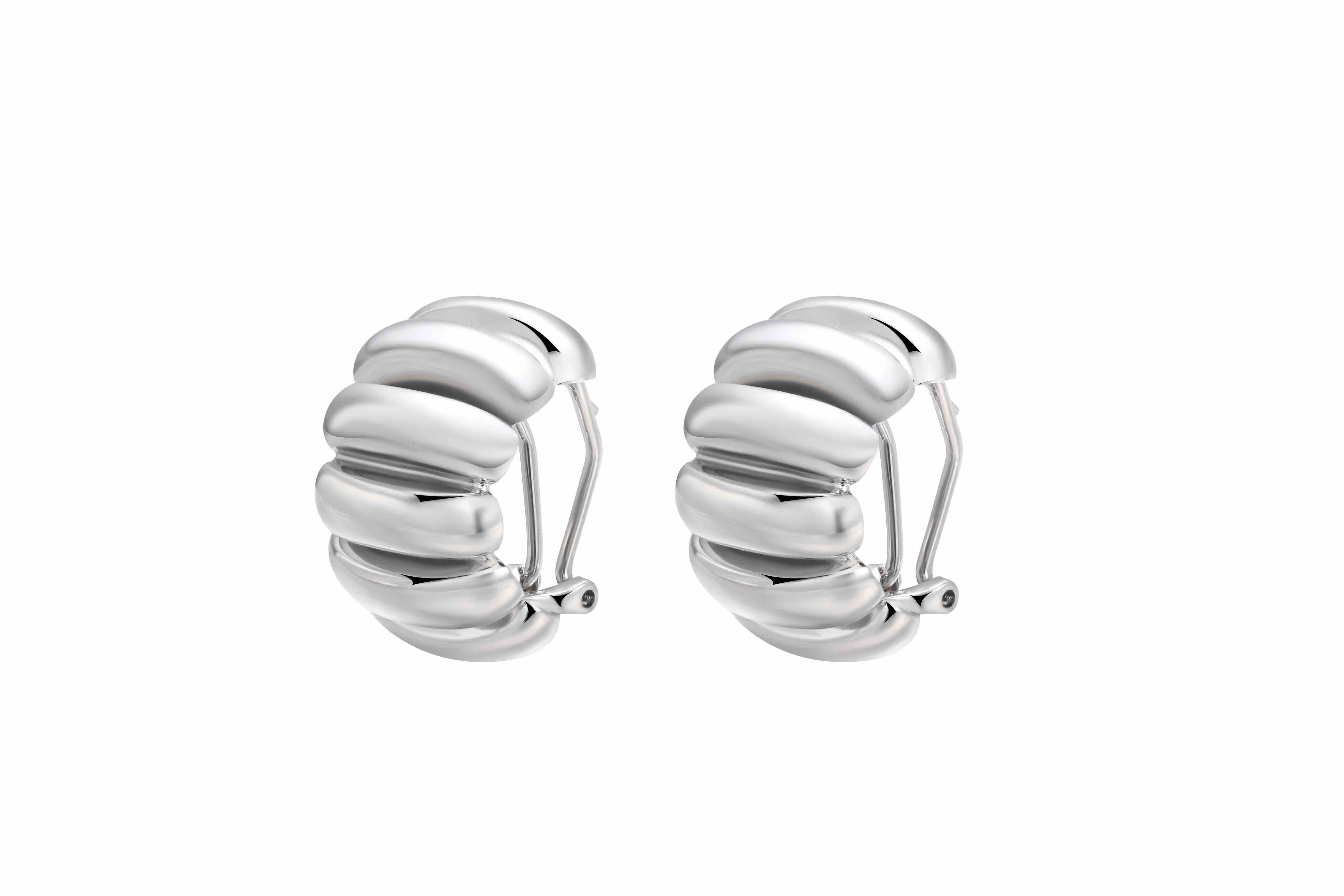 The Best Silver Hoop Earrings featuring a sculptural and chic design crafted from rhodium-plated brass.