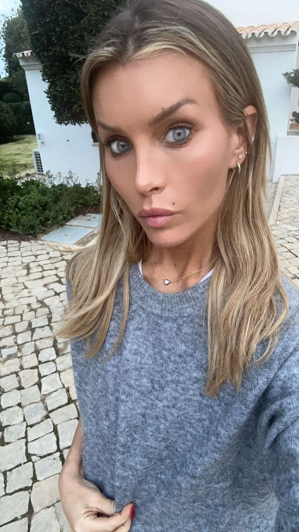 You Are Amazing And I Love You Heart Necklace worn by a woman with long blonde hair.