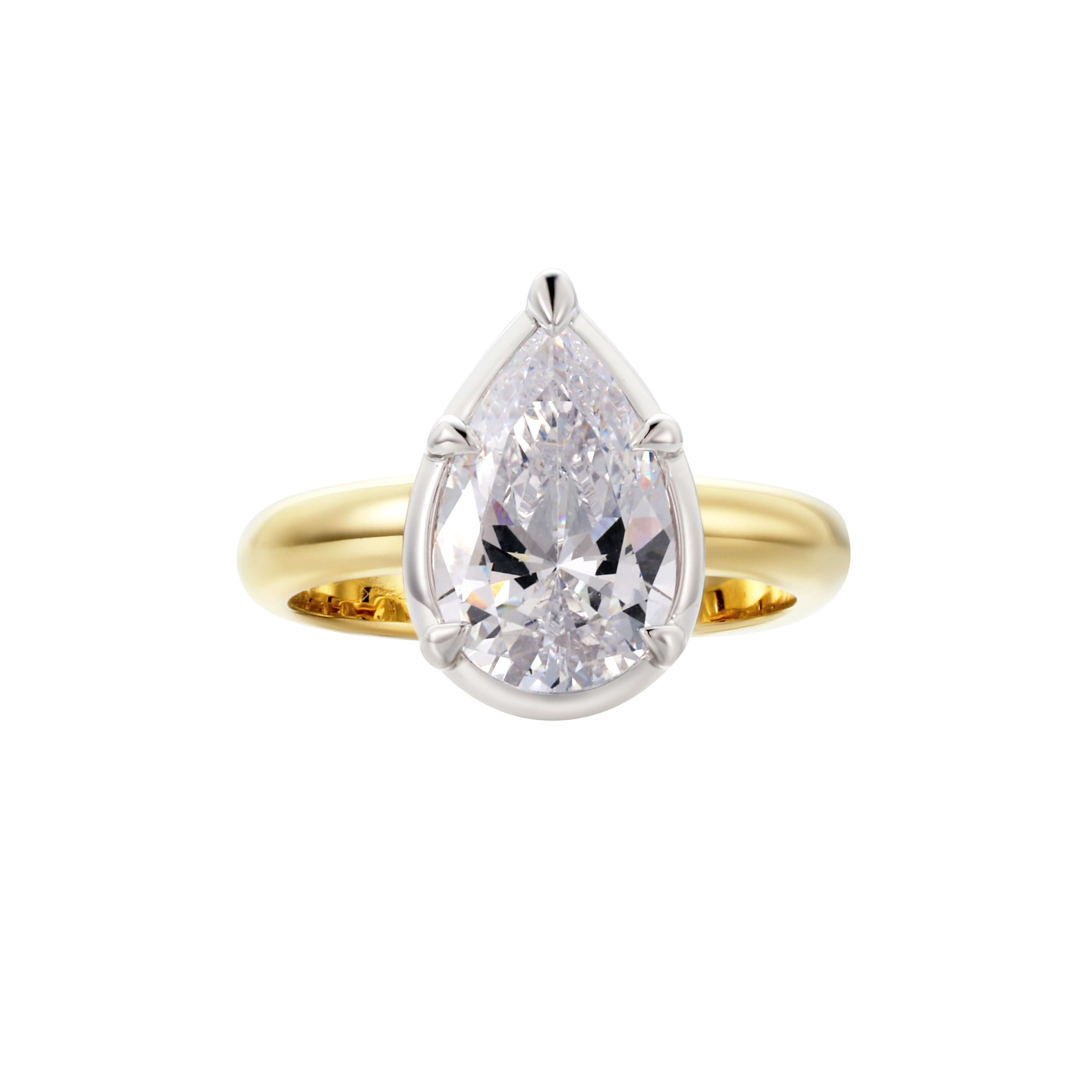 Excited About Everything Pinky Ring featuring a pear-cut cubic zirconia in a two-tone finish with gold and rhodium accents.