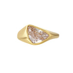 Girl Have Fun Ring featuring a sculptural triangular-cut stone in a smooth brass band with gold PVD plating.