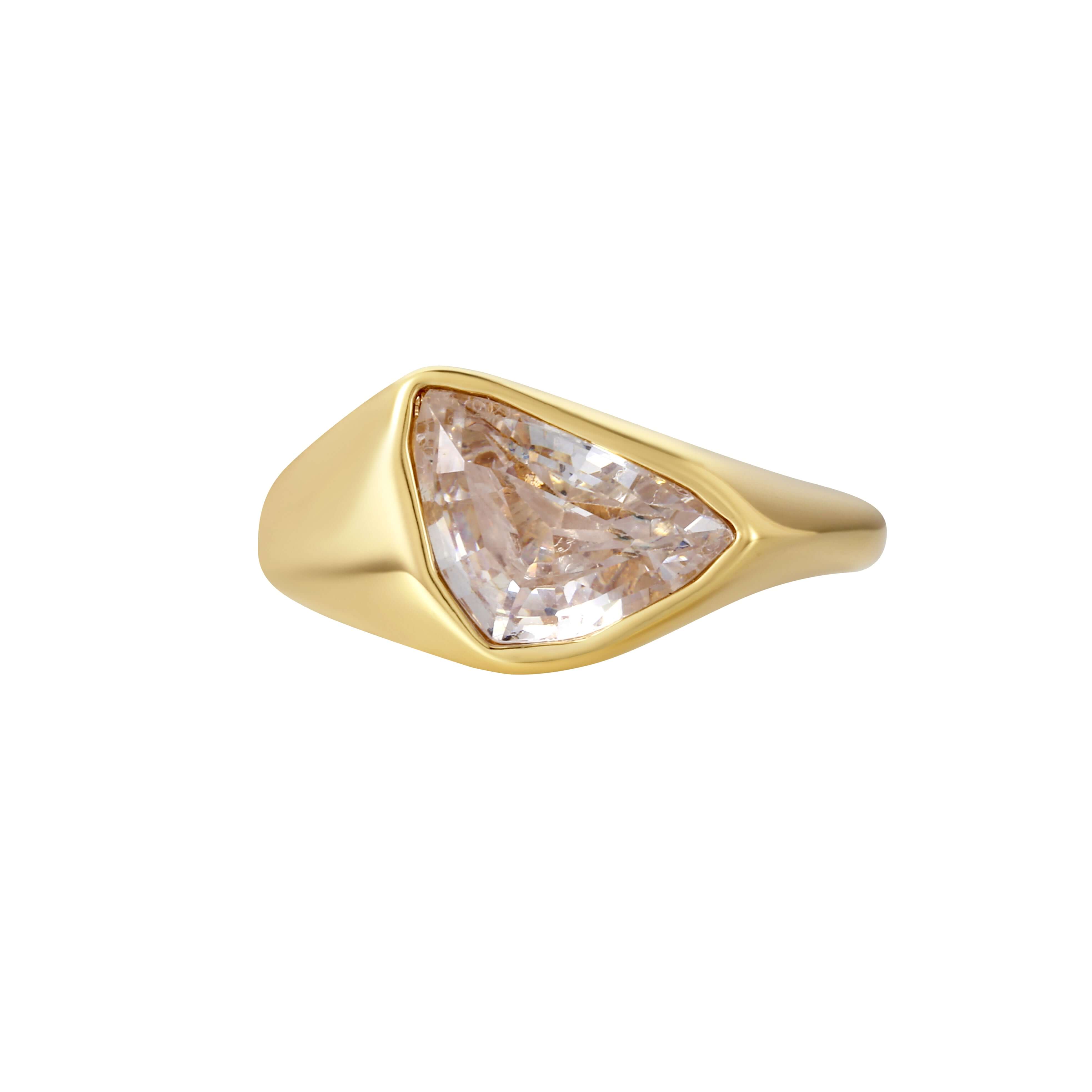 Girl Have Fun Ring featuring a sculptural triangular-cut stone in a smooth brass band with gold PVD plating.