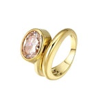 Love You Back Ring featuring an oversized oval-cut stone in a fluid sculptural setting, crafted from brass.