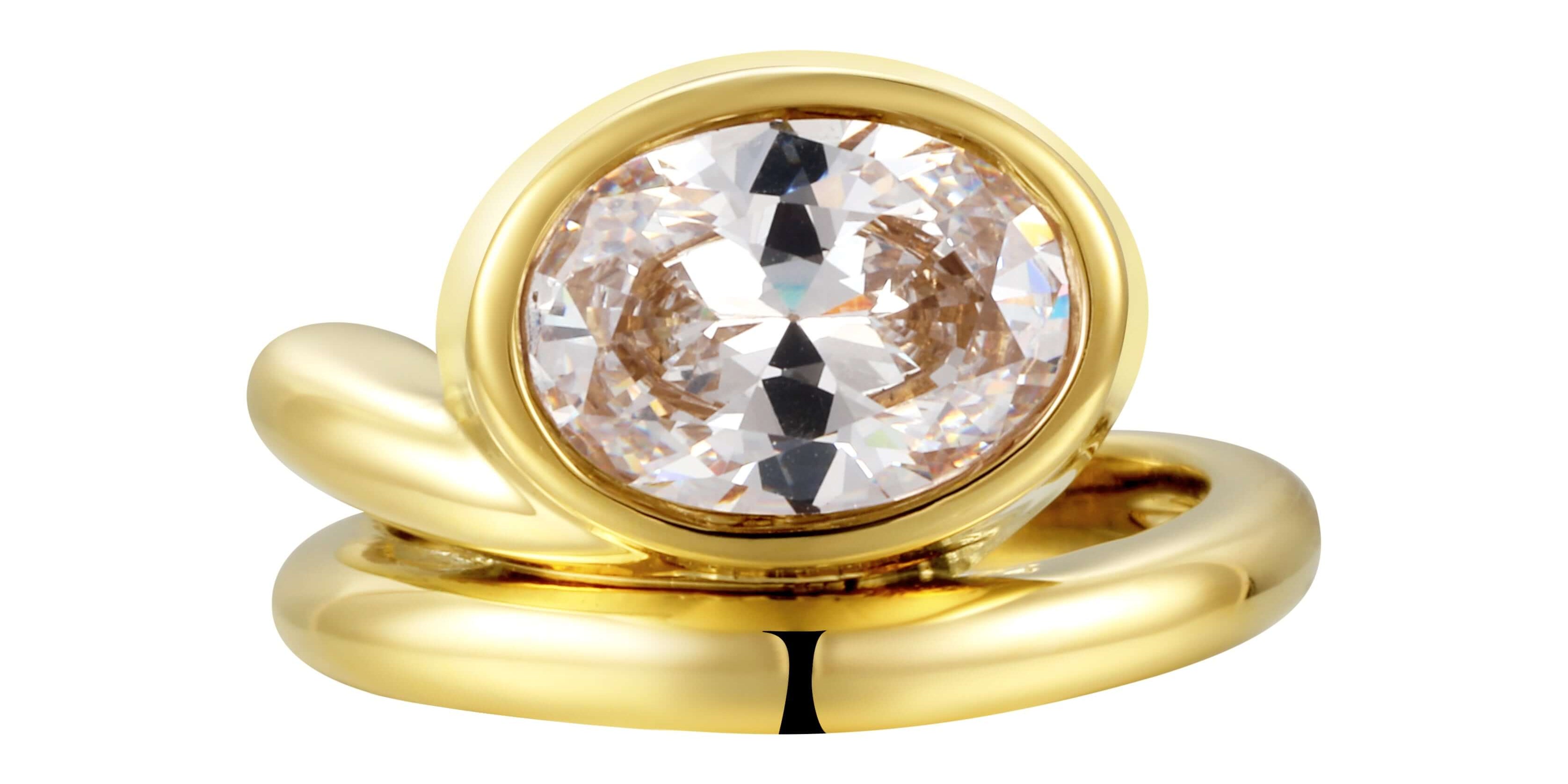 Love You Back Ring featuring an oversized oval-cut stone in a fluid sculptural setting with gold plating.