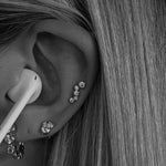 Close-up of an ear showcasing Holy Chic! Earrings from OneWildOne with sparkle and elegance.