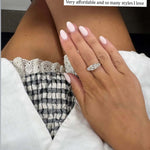 The Rest Of The World Can Wait East-West Silver Ring worn on a hand with manicured nails.