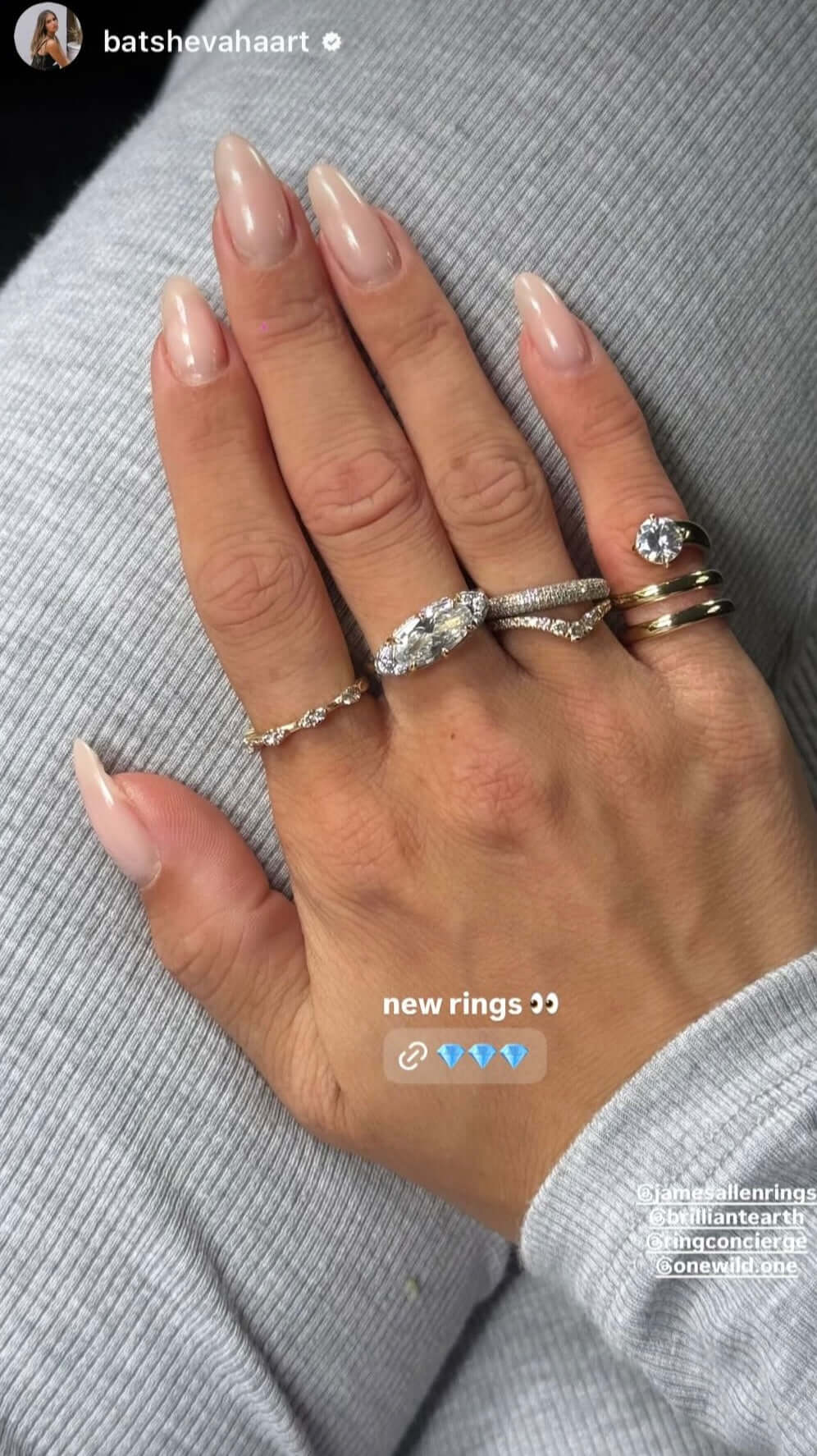 Hand adorned with new rings, showcasing The Rest Of The World Can Wait East-West Silver Ring.