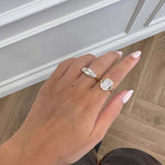 Close-up of a hand wearing rings, showcasing the Be Your Own Muse Gold Ring among other jewelry pieces.