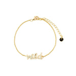 Wild Like The West Script Bracelet in 14k gold plating with adjustable sizing for a perfect fit.