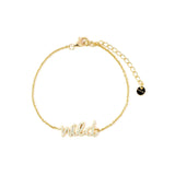 Wild Like The West Script Bracelet in 14k gold plating with adjustable sizing for a perfect fit.
