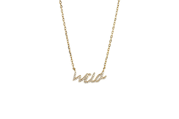 This Wild Soul Script Necklace featuring a gold-plated 'wild' pendant on a delicate chain.