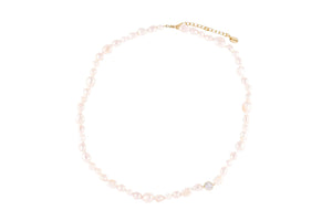 Pearl's A Singer Necklace featuring freshwater pearls on a 925 sterling silver chain with 14k gold plating and cubic zirconia.