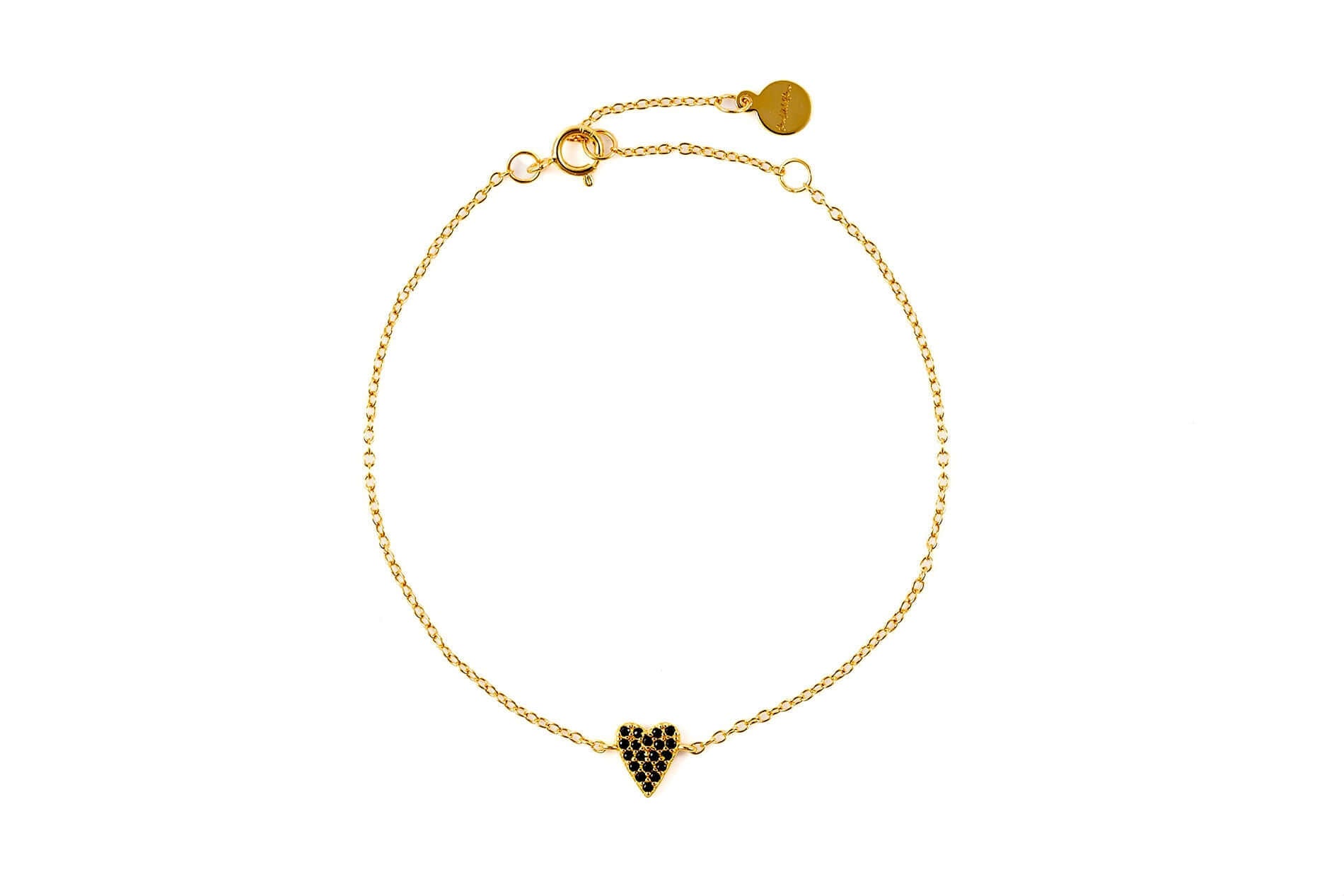 She's So Lucky Black Heart Bracelet featuring a black CZ heart pendant and adjustable gold chain.