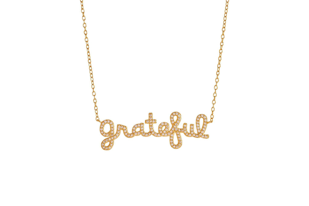 Grateful Script Gold Necklace with sparkling letters on a delicate chain showcased against a white background.