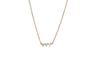 Starburst Opal Pendant Necklace featuring delicate opal stones on a 14k gold plated chain.