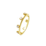 Endless Potential Aura Stacking Ring Gold with sparkling gems and a delicate gold band.