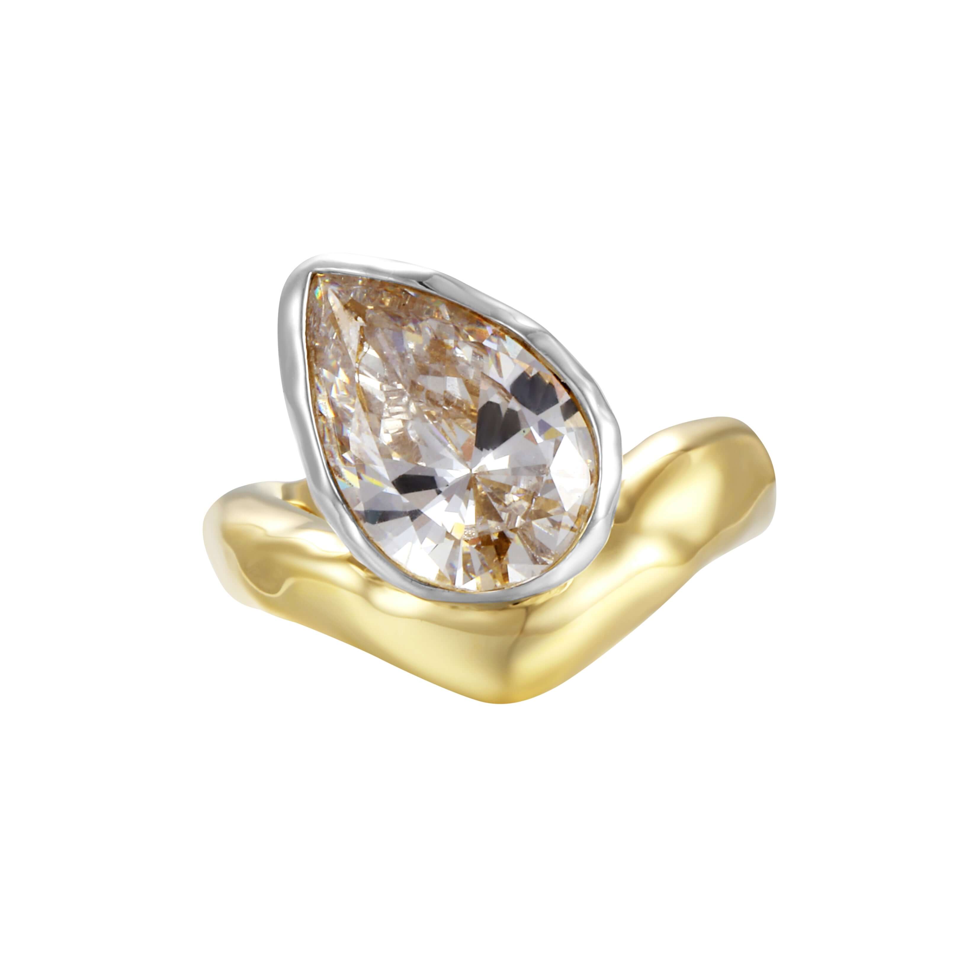 Perfectly Imperfect Ring featuring a sculpted molten gold band and pear-cut stone.