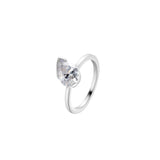 Love This For You Silver Tilted Pear Pinky Ring showcasing a sparkling pear-shaped stone on a sleek silver band.