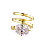 As Good As It Gets Coil Ring showcasing a sculptural design with a brilliant oval-cut cubic zirconia in gold finish.