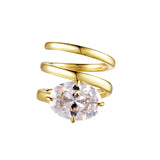 As Good As It Gets Coil Ring showcasing a sculptural design with a brilliant oval-cut cubic zirconia in gold finish.