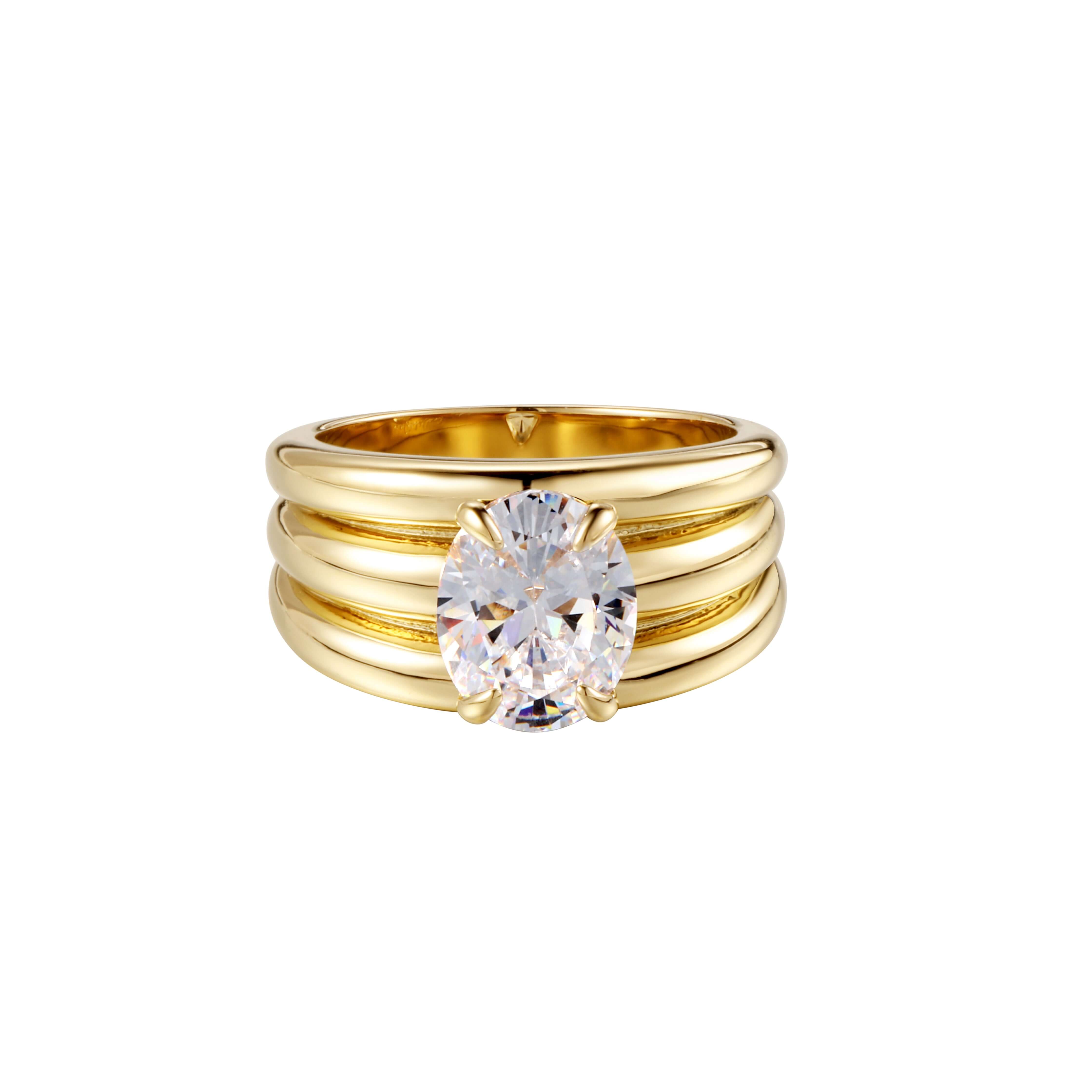 Love Bug Ring featuring stacked gold bands and a brilliant oval stone for a vintage modern look.