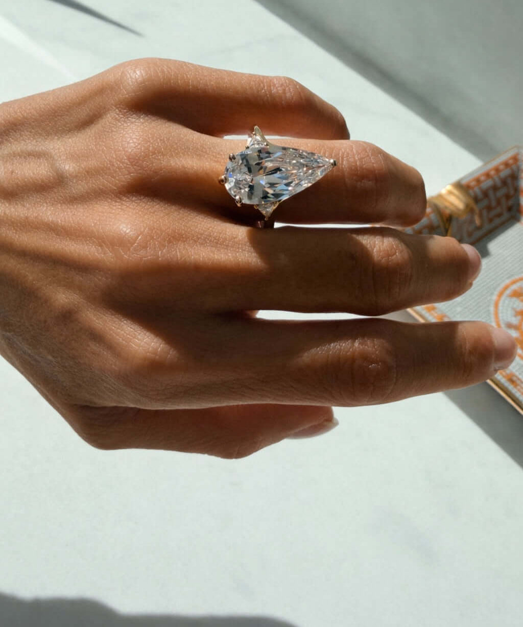 Nothing Like It Ring showcased on a hand, featuring a pear-cut cubic zirconia for a striking sparkle.