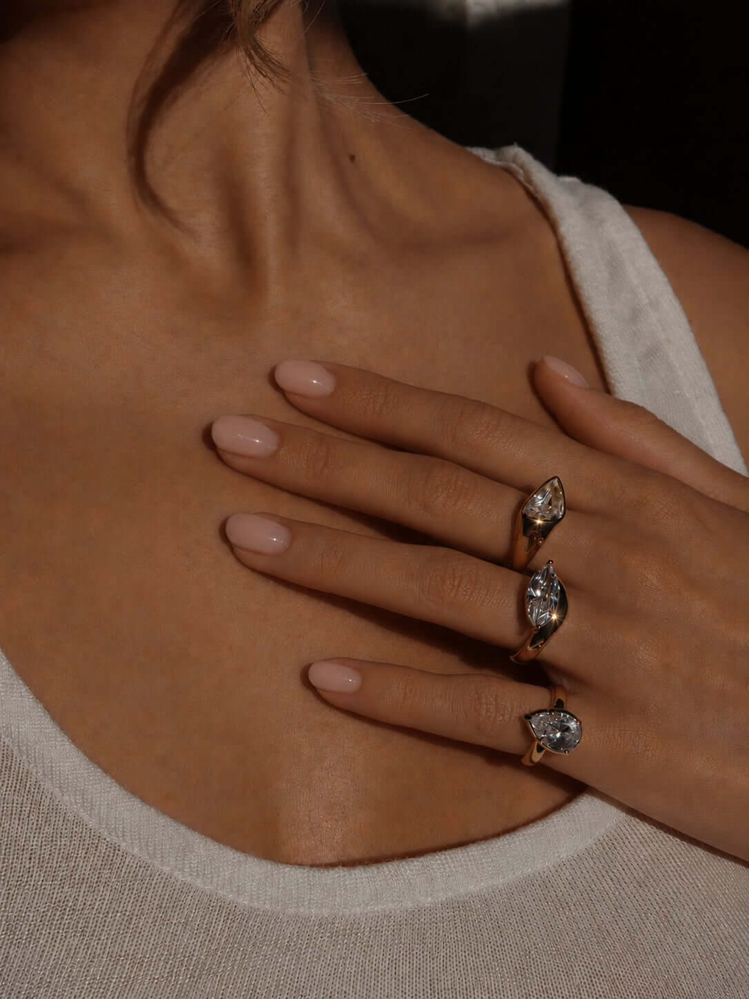 Girl Have Fun Ring collection displayed on a model's hand featuring elegant triangular-cut stones.